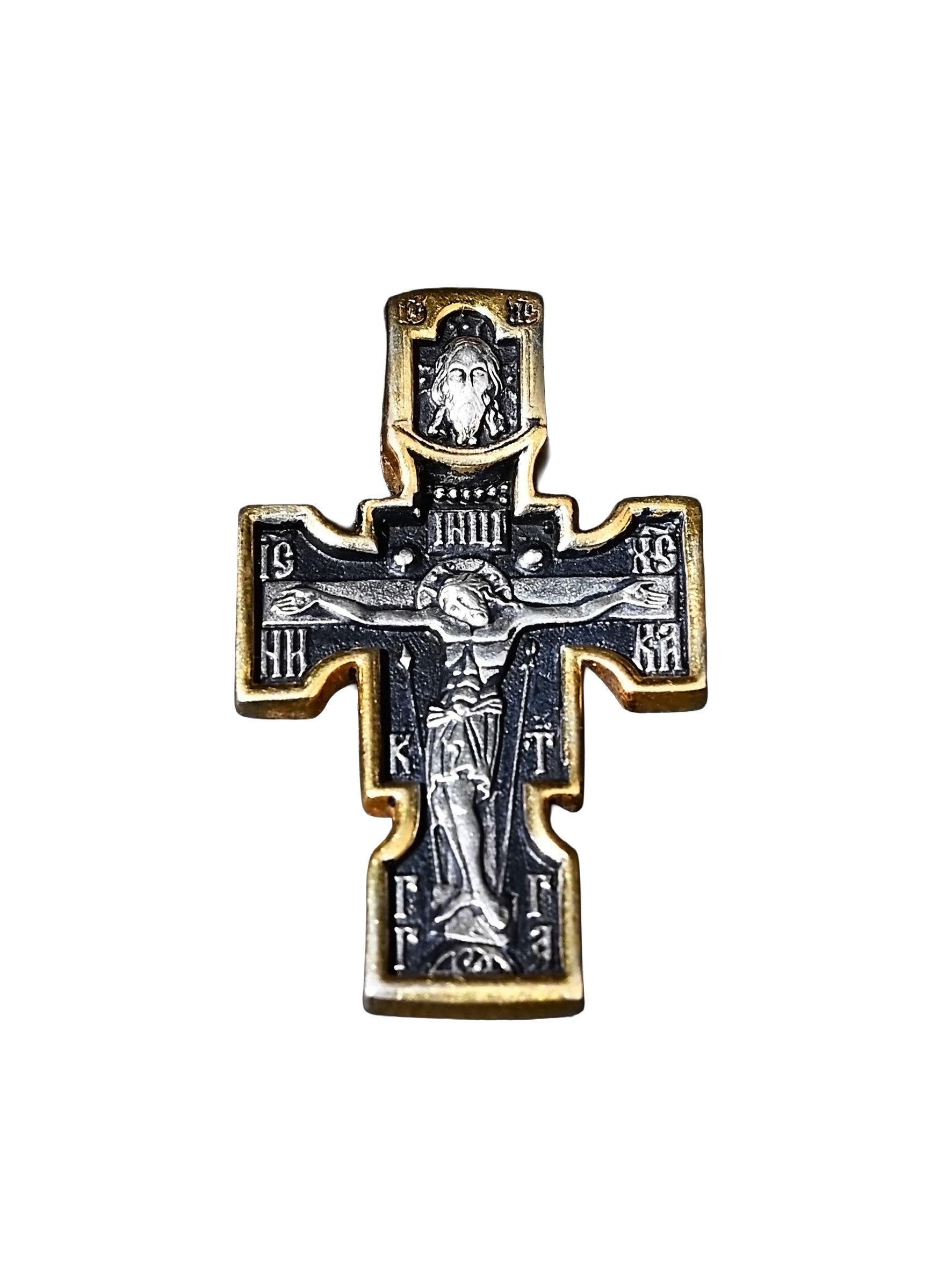 Decorative cross with religious iconography on a white background
