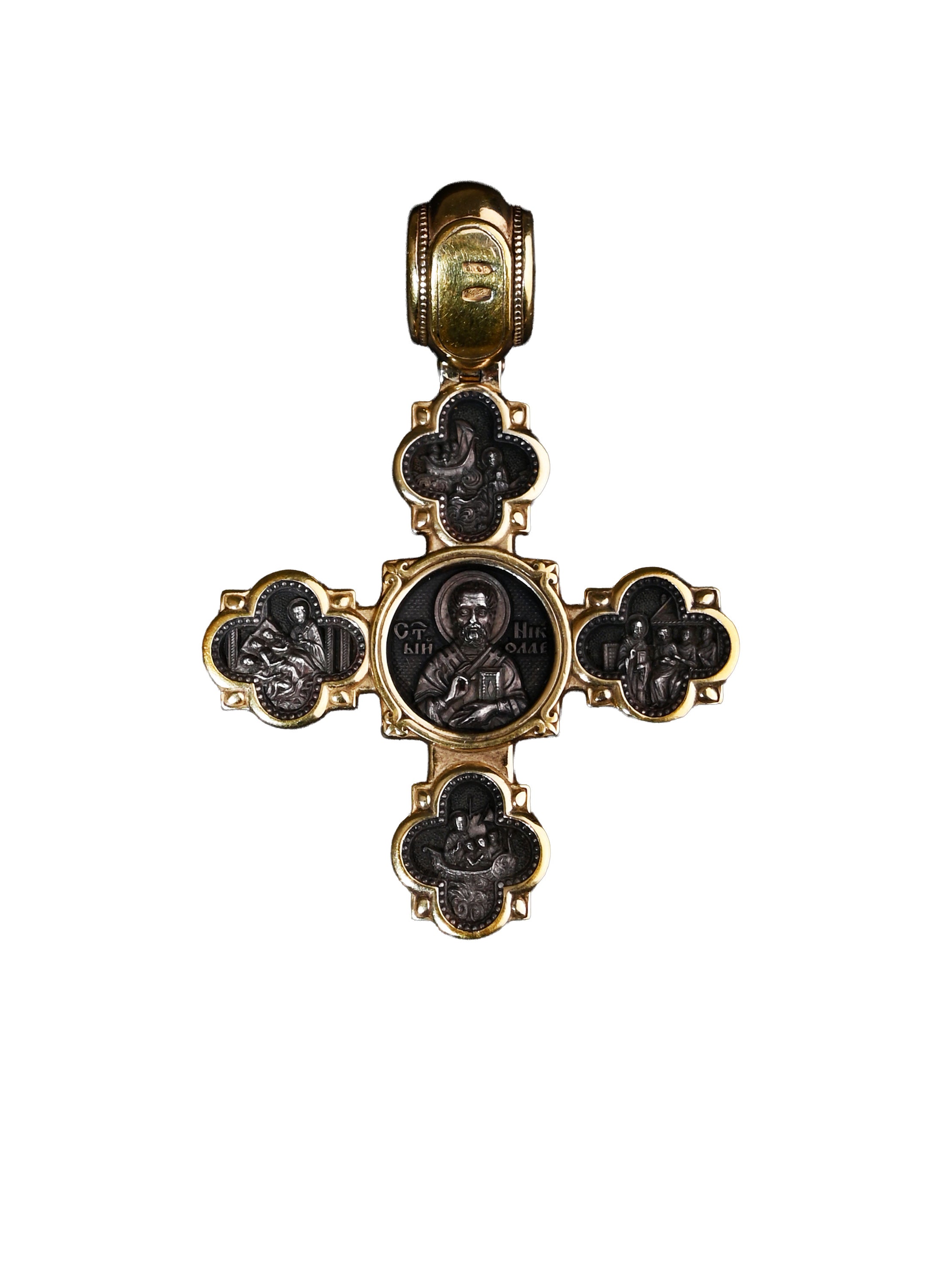 Decorative cross pendant with religious iconography on a white background
