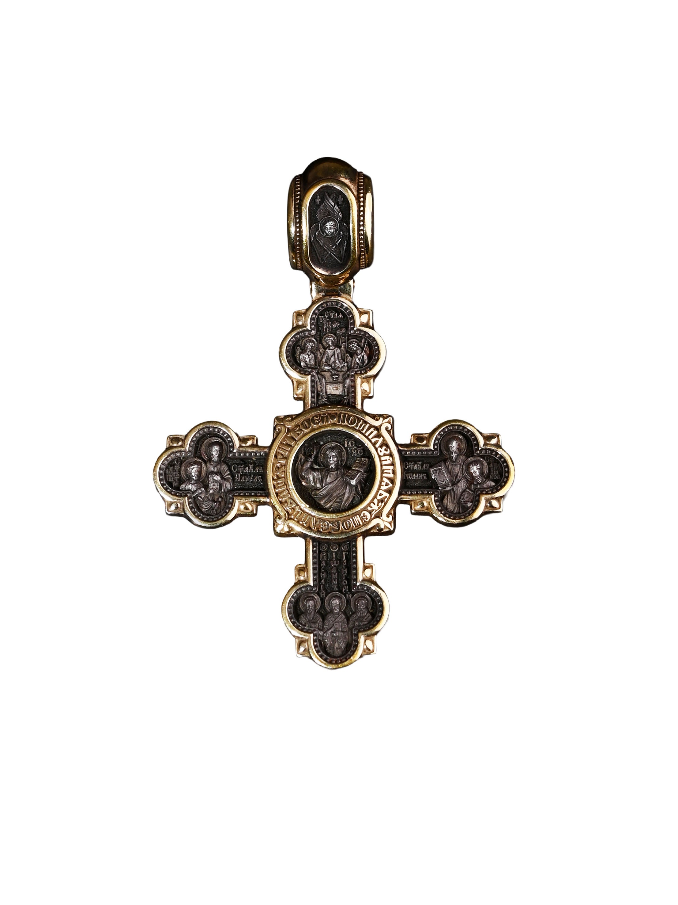 Decorative cross pendant with religious iconography on a white background