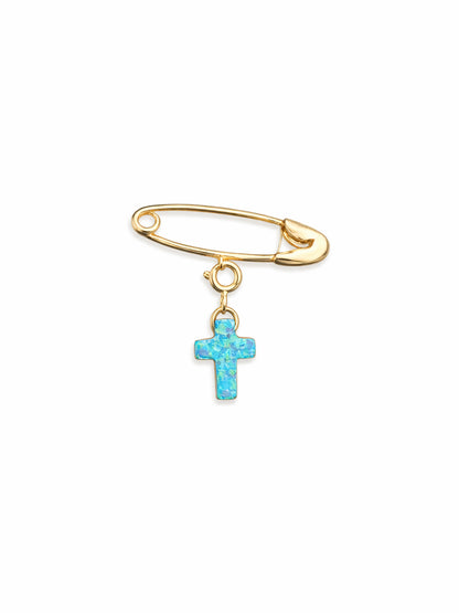 Gold safety pin with a turquoise cross charm on a white background